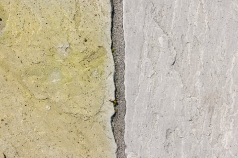 Cleaning garden patio. Sandstone paving before and after jet washing or pressure washing, UK.