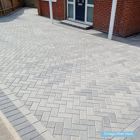 Modern driveway with herringbone patterned pavers