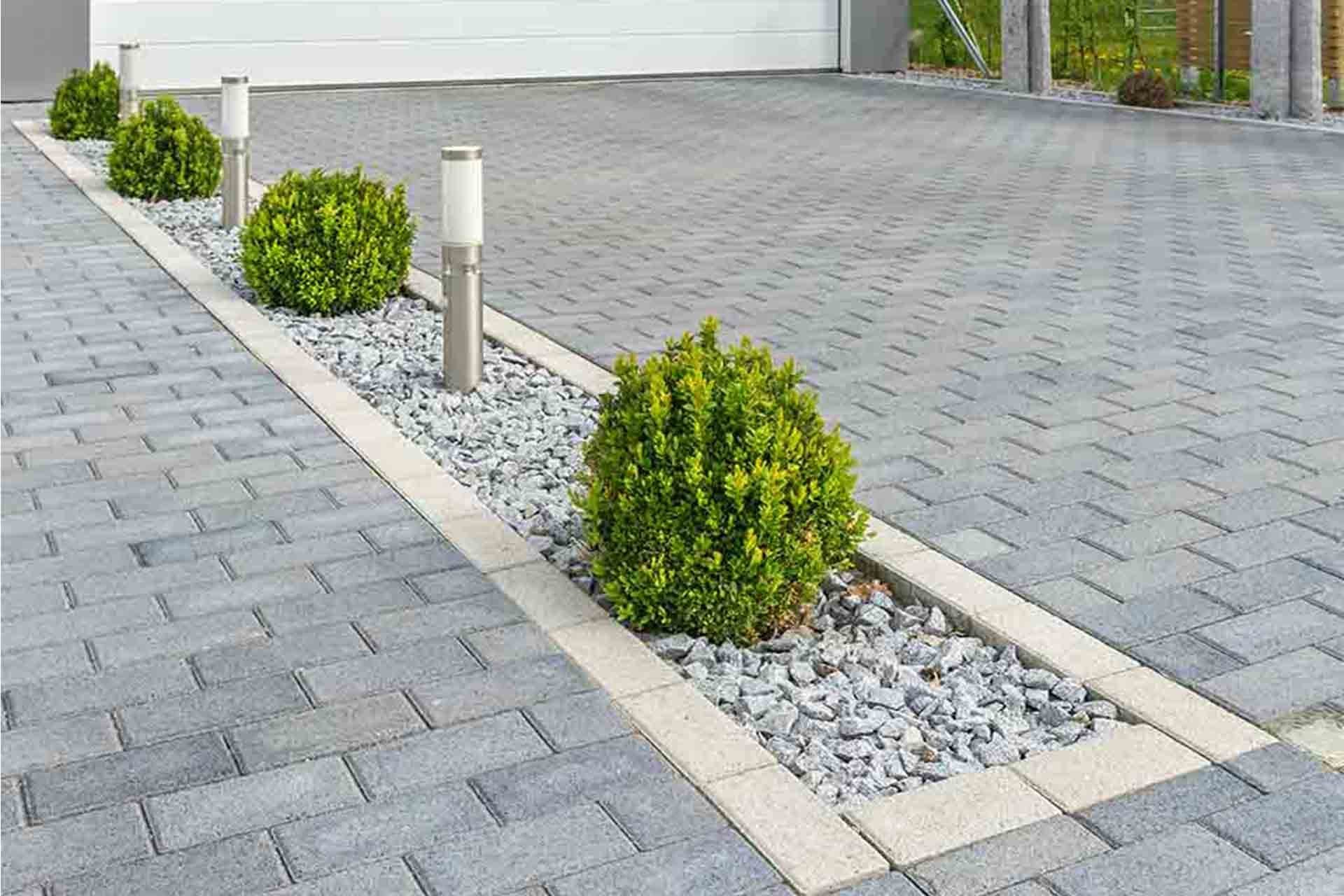 Modern paved driveway with decorative landscaping