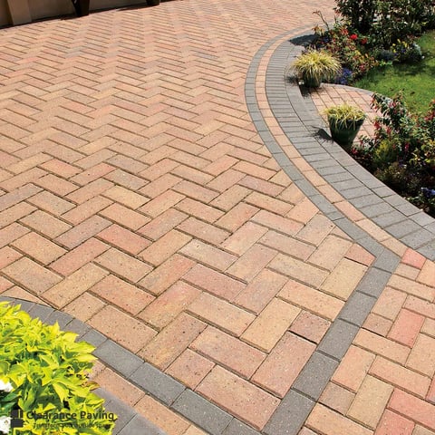 Decorative brick patio with herringbone pattern